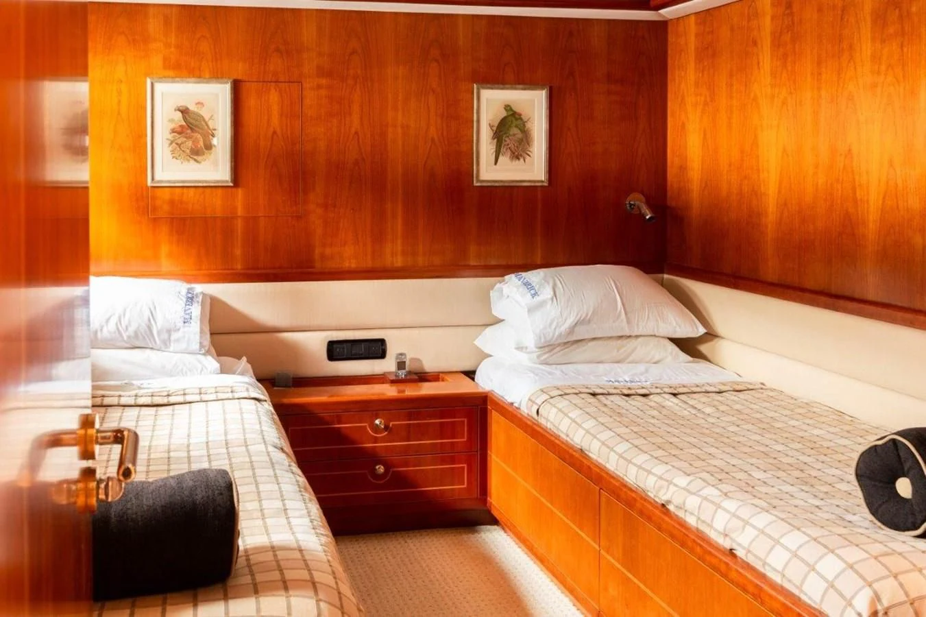 a room with two beds aboard MAVERICK Yacht for Sale