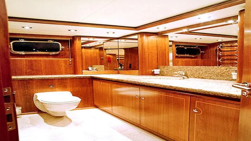 a bathroom with a toilet and a sink aboard MAVERICK Yacht for Sale