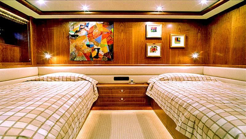 a couple of beds in a room aboard MAVERICK Yacht for Sale