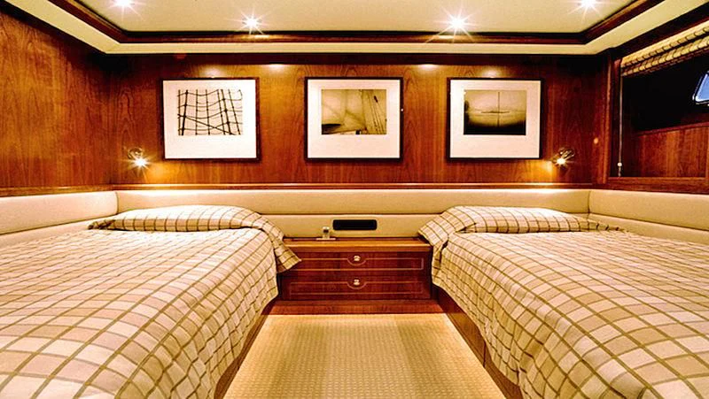 a room with two beds aboard MAVERICK Yacht for Sale