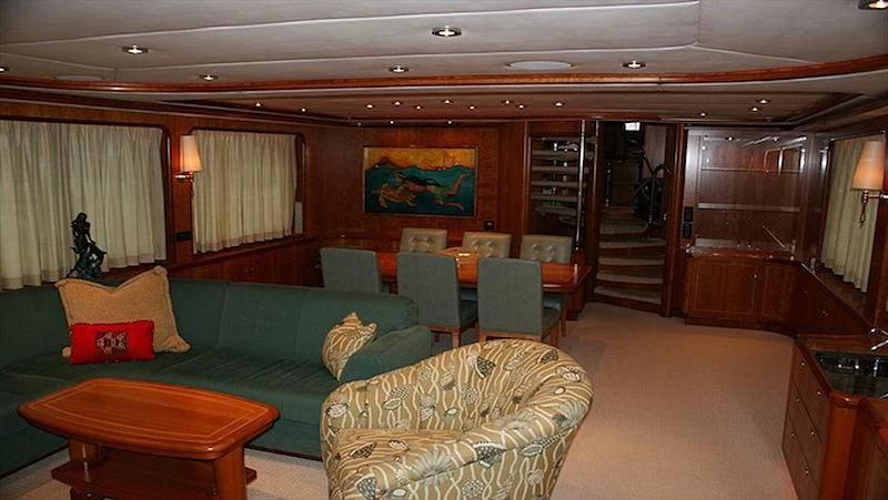 a living room with a couch and a table aboard MAVERICK Yacht for Sale