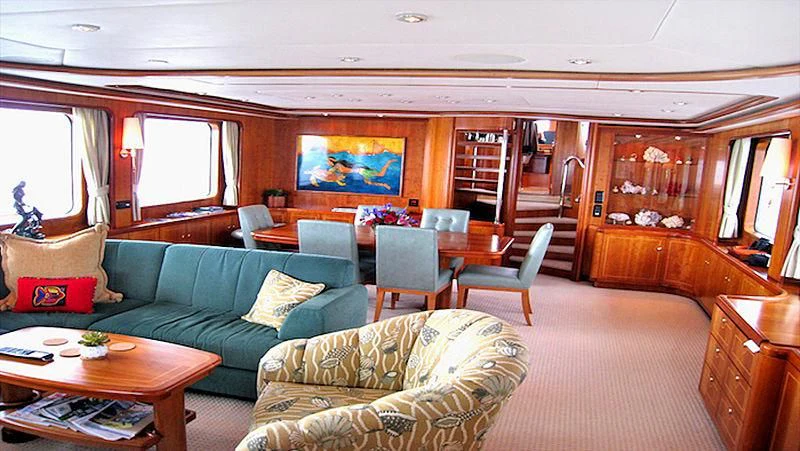 a living room with a couch and a table aboard MAVERICK Yacht for Sale