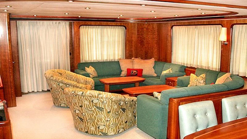 a living room with a couch and a chair aboard MAVERICK Yacht for Sale