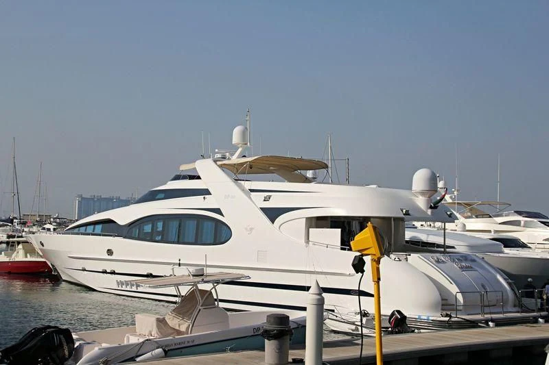 a white yacht docked aboard LA VIE EN ROSE Yacht for Sale