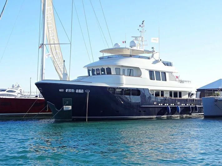 a large boat in the water aboard SMILING T Yacht for Sale