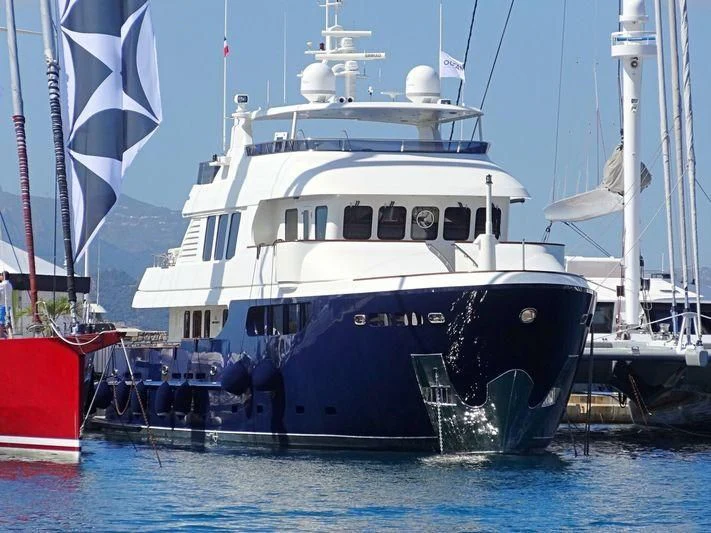 a large boat in the water aboard SMILING T Yacht for Sale