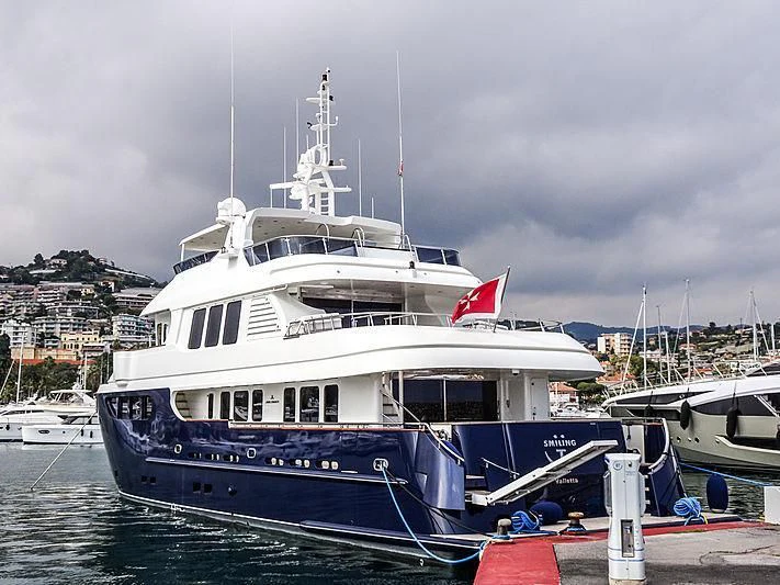 a large boat docked aboard SMILING T Yacht for Sale