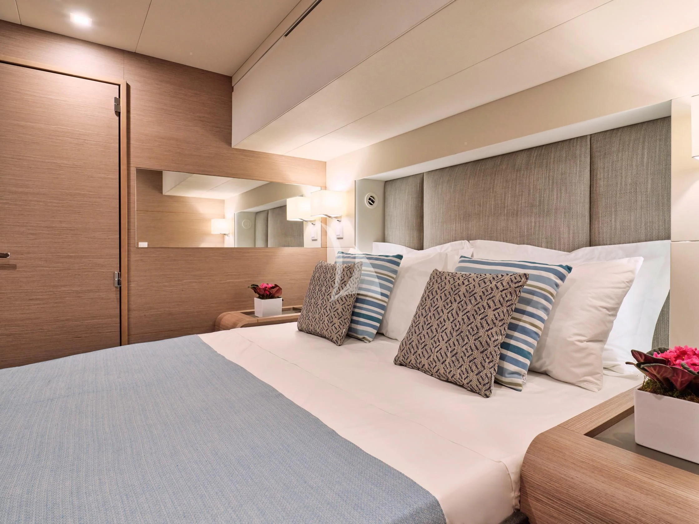 a bed with pillows and pillows aboard APHAEA Yacht for Charter
