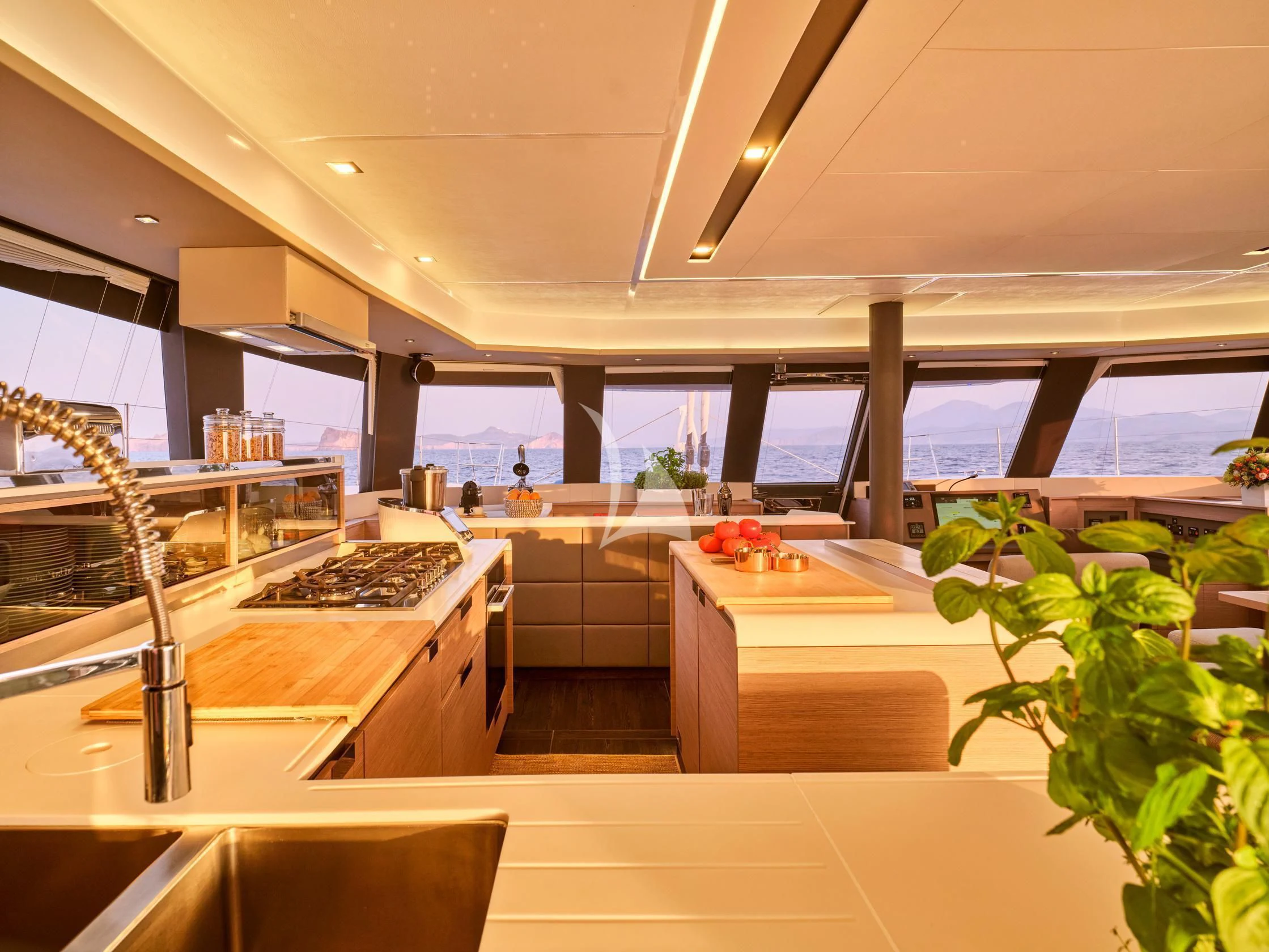 a kitchen with a large window aboard APHAEA Yacht for Charter