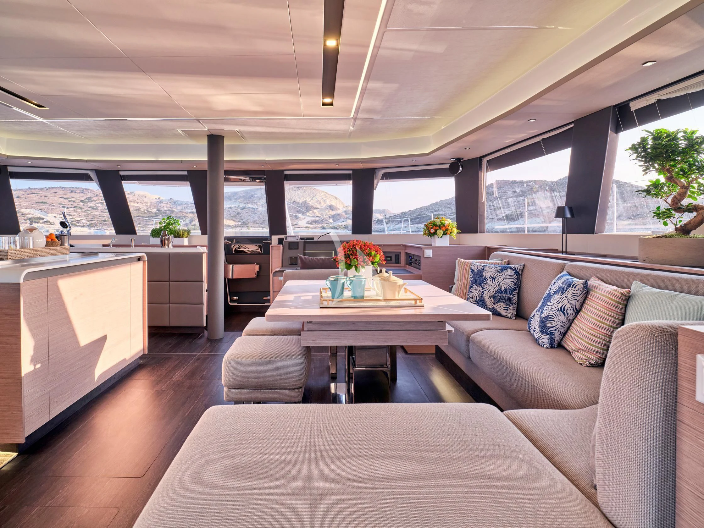 a living room with a couch and a table aboard APHAEA Yacht for Charter