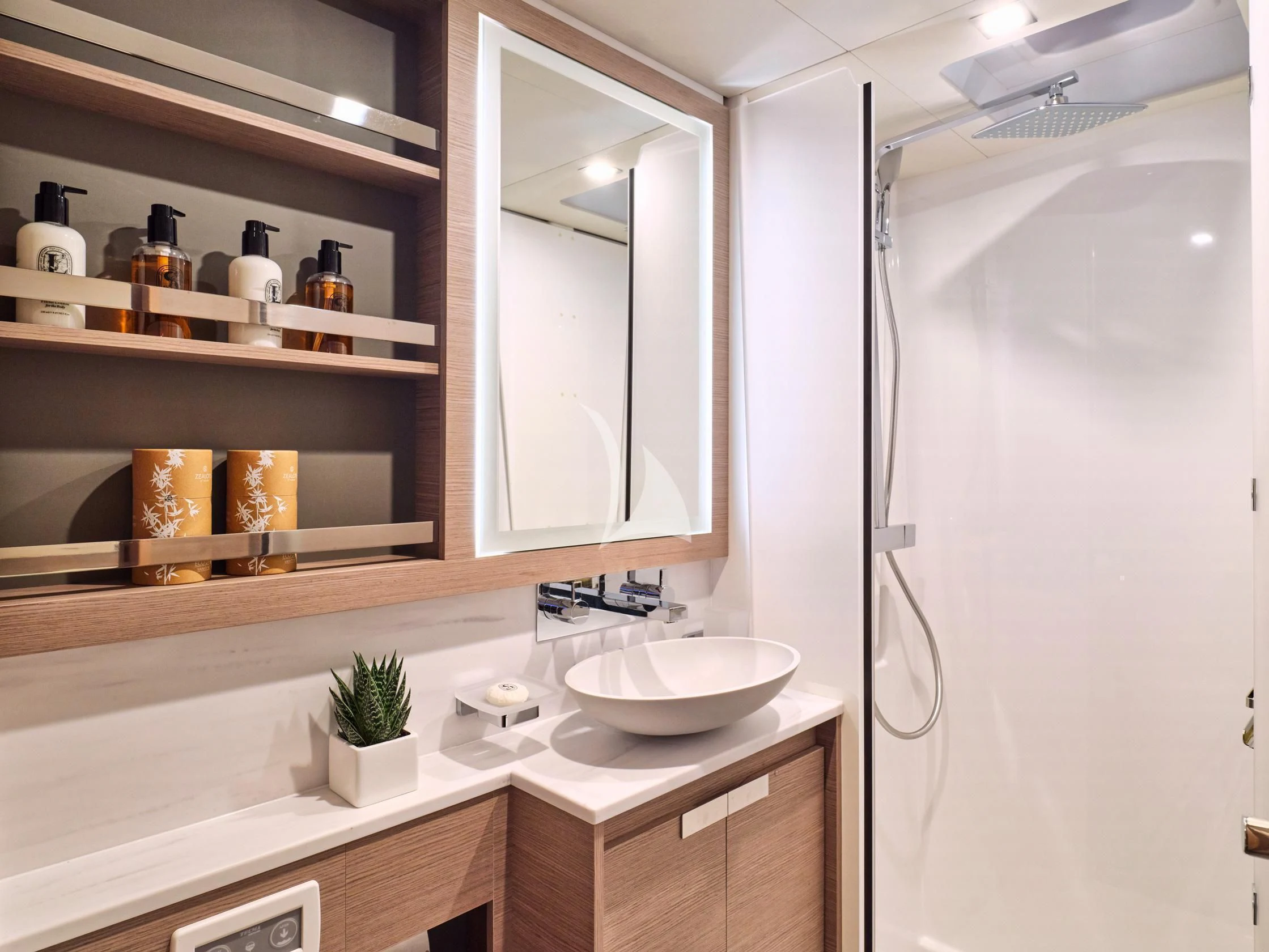 a bathroom with a sink and a mirror aboard APHAEA Yacht for Charter