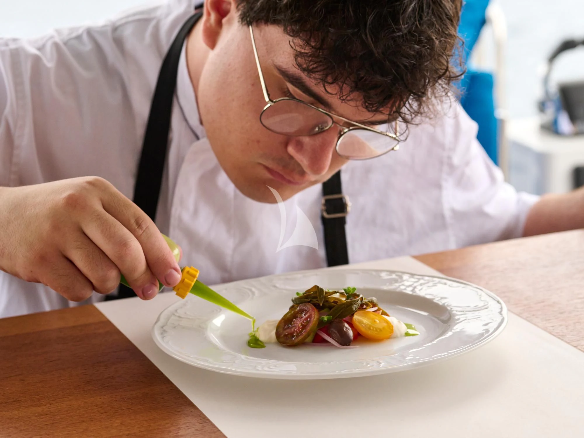 a person eating food aboard APHAEA Yacht for Charter