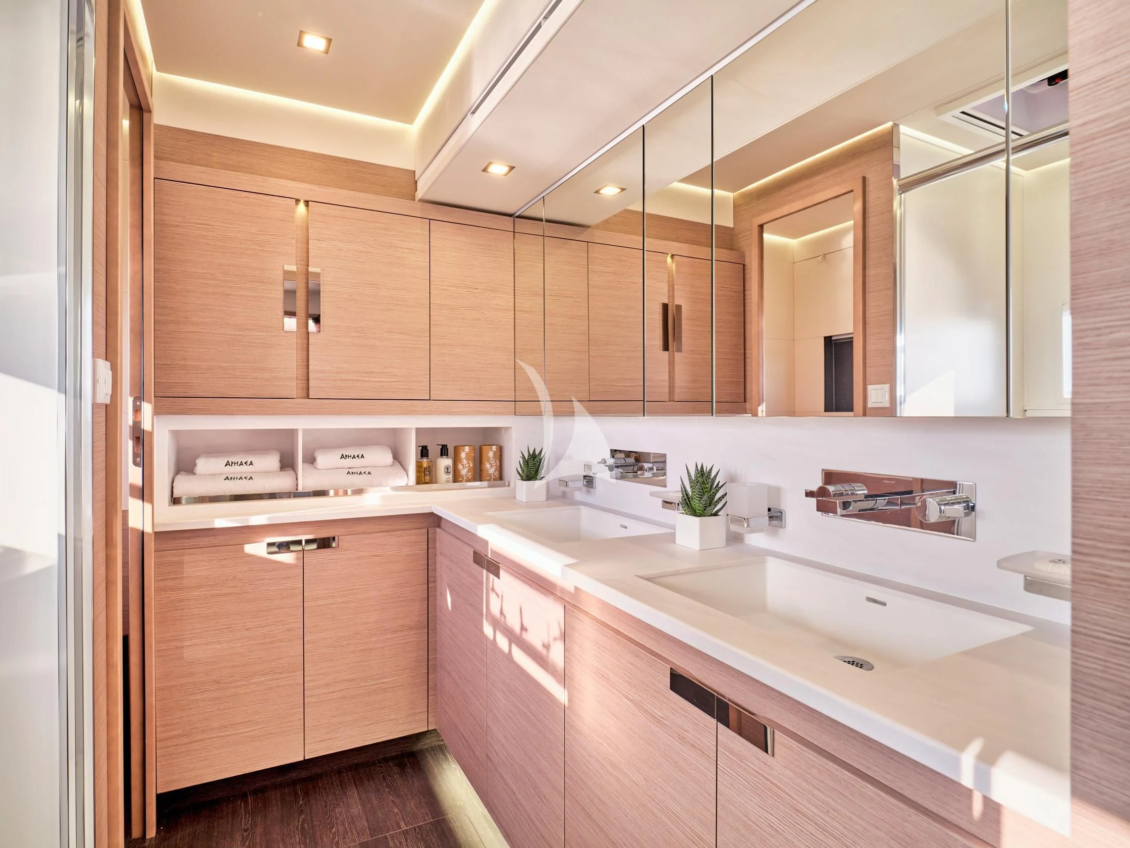 a kitchen with wooden cabinets aboard APHAEA Yacht for Charter