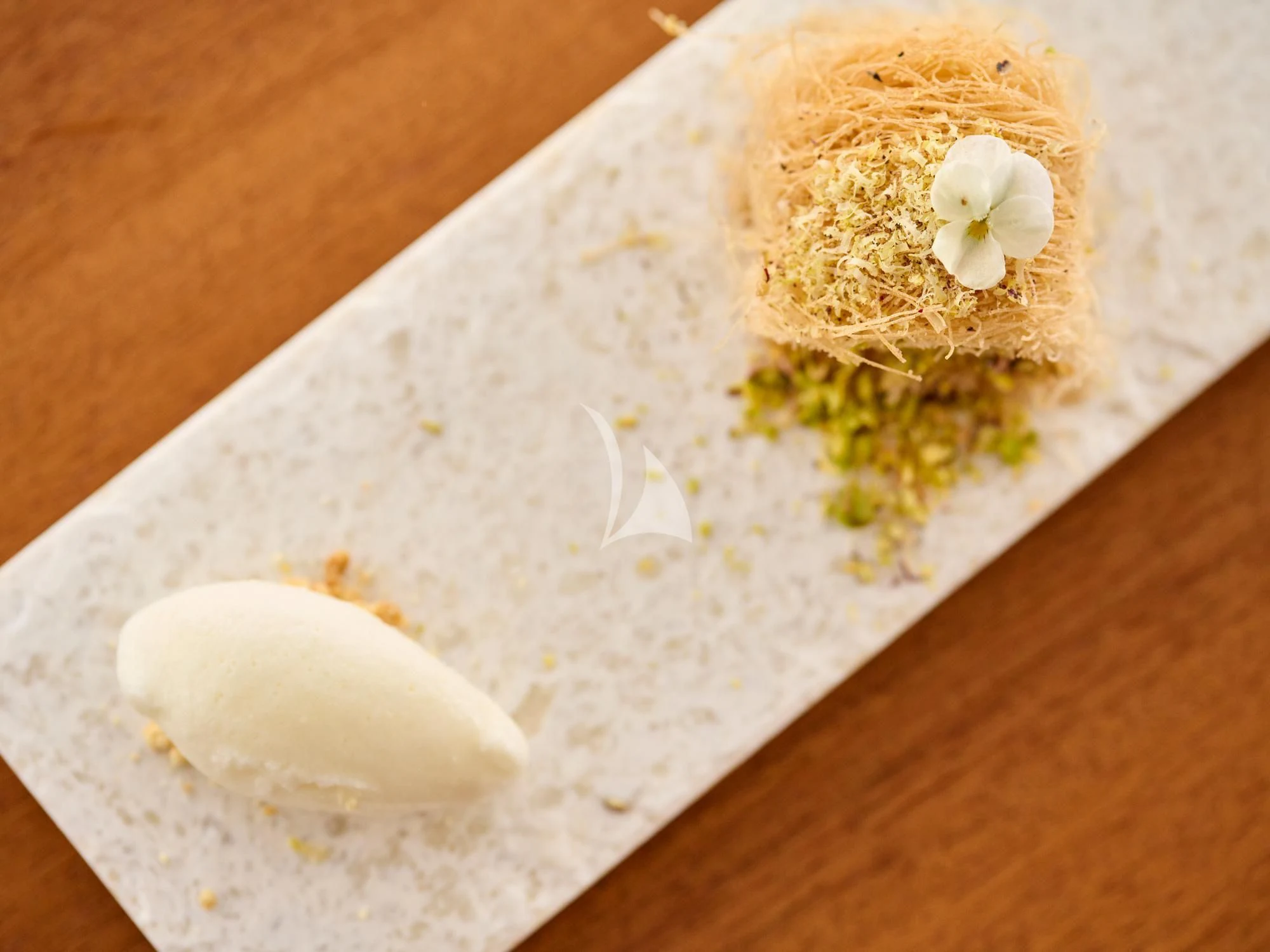 a sandwich on a plate aboard APHAEA Yacht for Charter