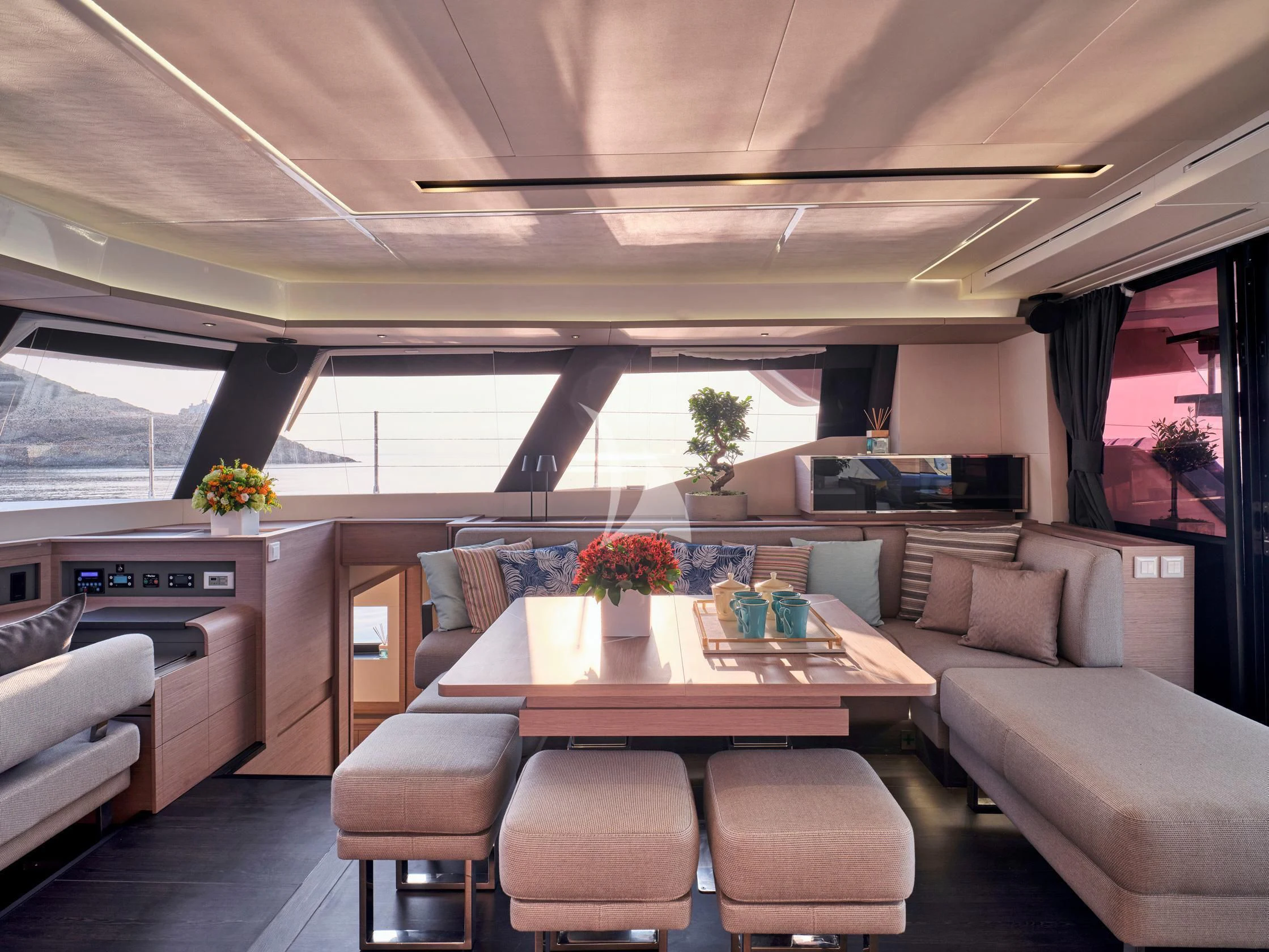 a living room with a table and chairs aboard APHAEA Yacht for Charter