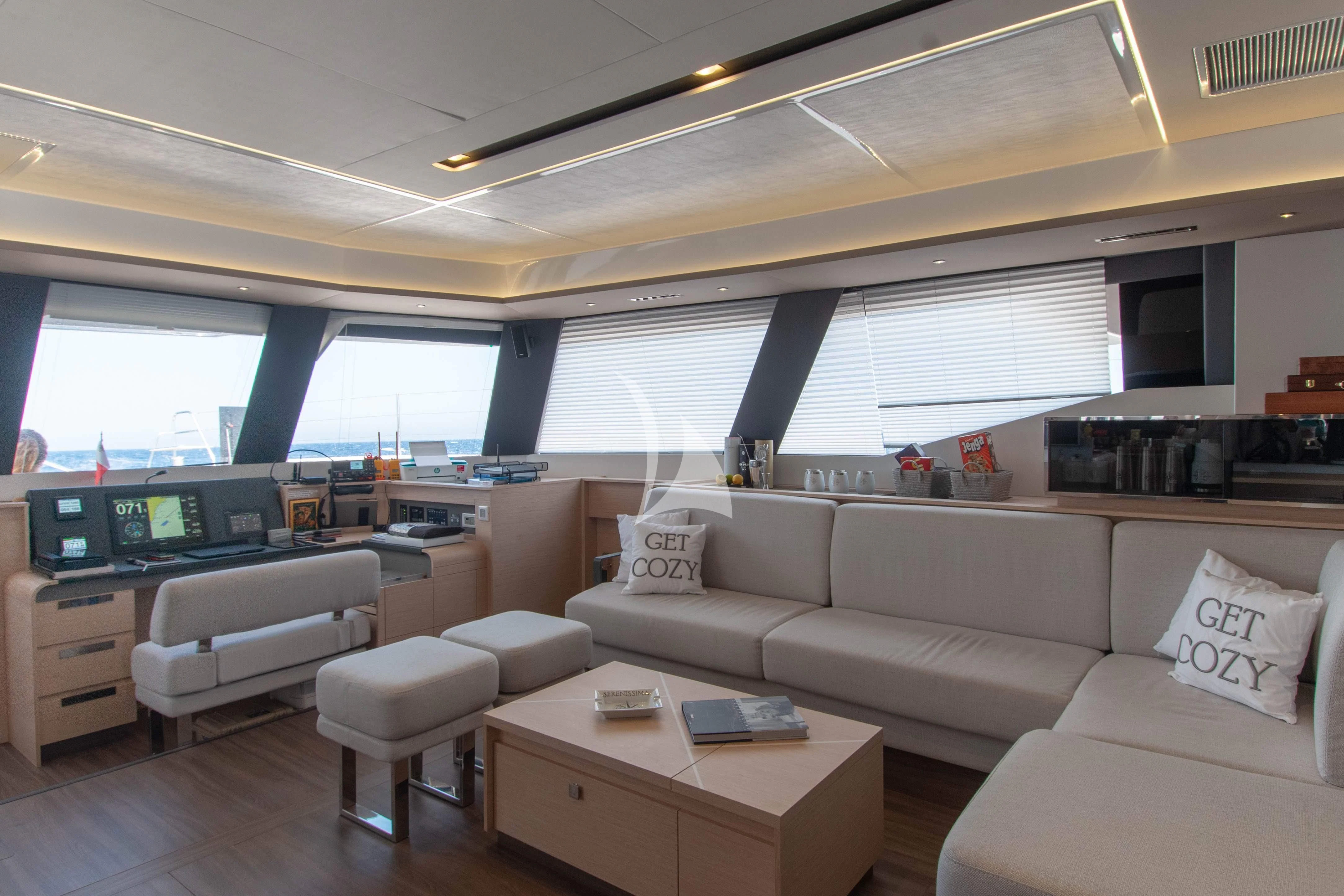 a living room with a couch and a table aboard APHAEA Yacht for Charter