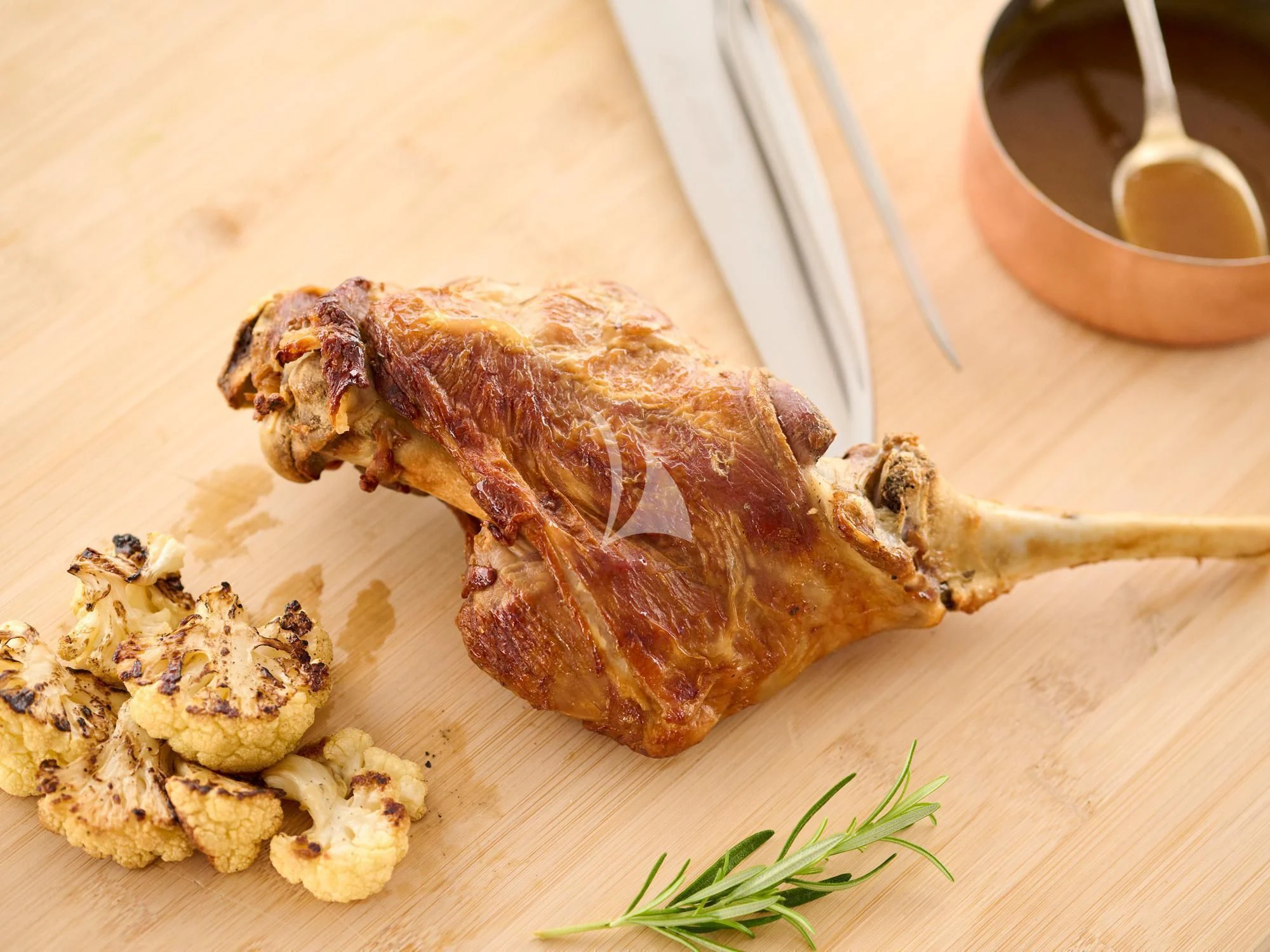 a piece of meat being cooked aboard APHAEA Yacht for Charter