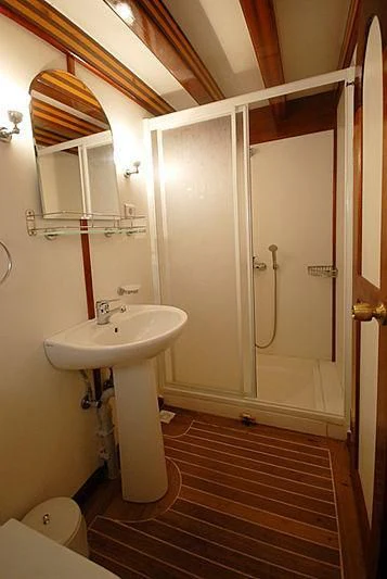 a bathroom with a sink and a shower aboard BAHRIYELI C Yacht for Sale