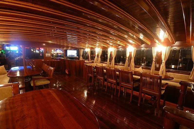 a bar with a large table and chairs aboard BAHRIYELI C Yacht for Sale