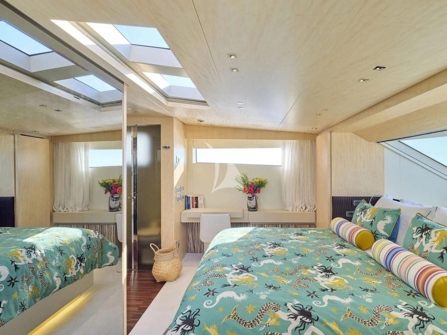 a bedroom with a bed and a desk aboard RARE DIAMOND Yacht for Sale