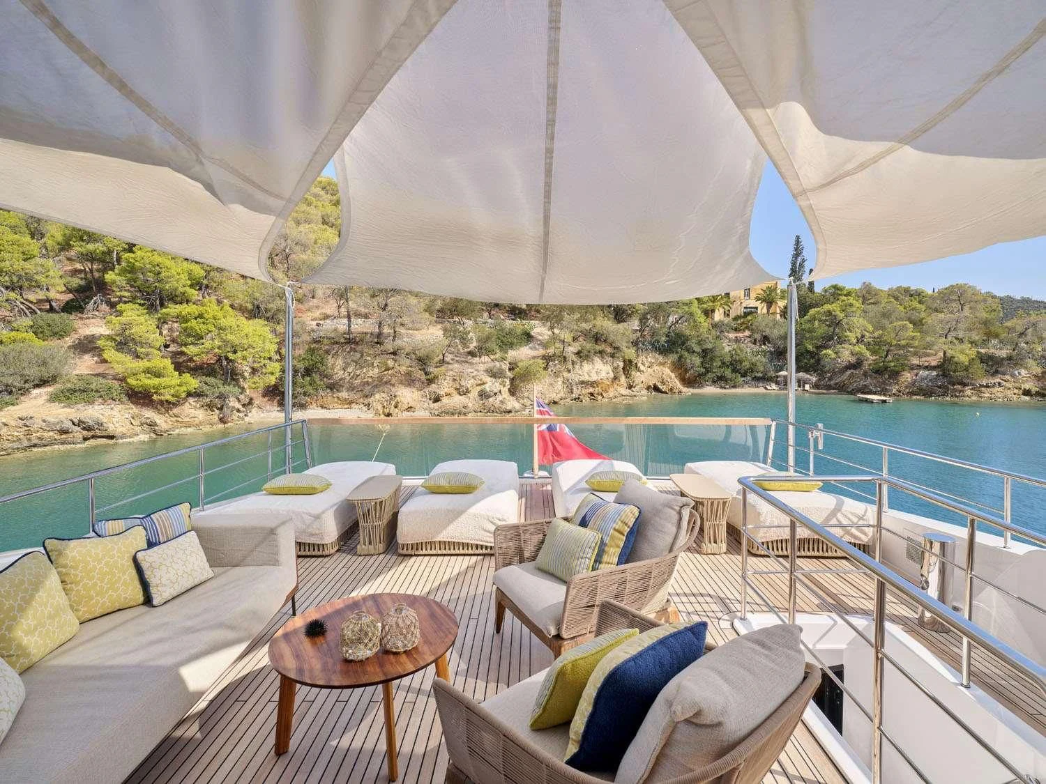 a patio with a table and chairs on it aboard RARE DIAMOND Yacht for Sale