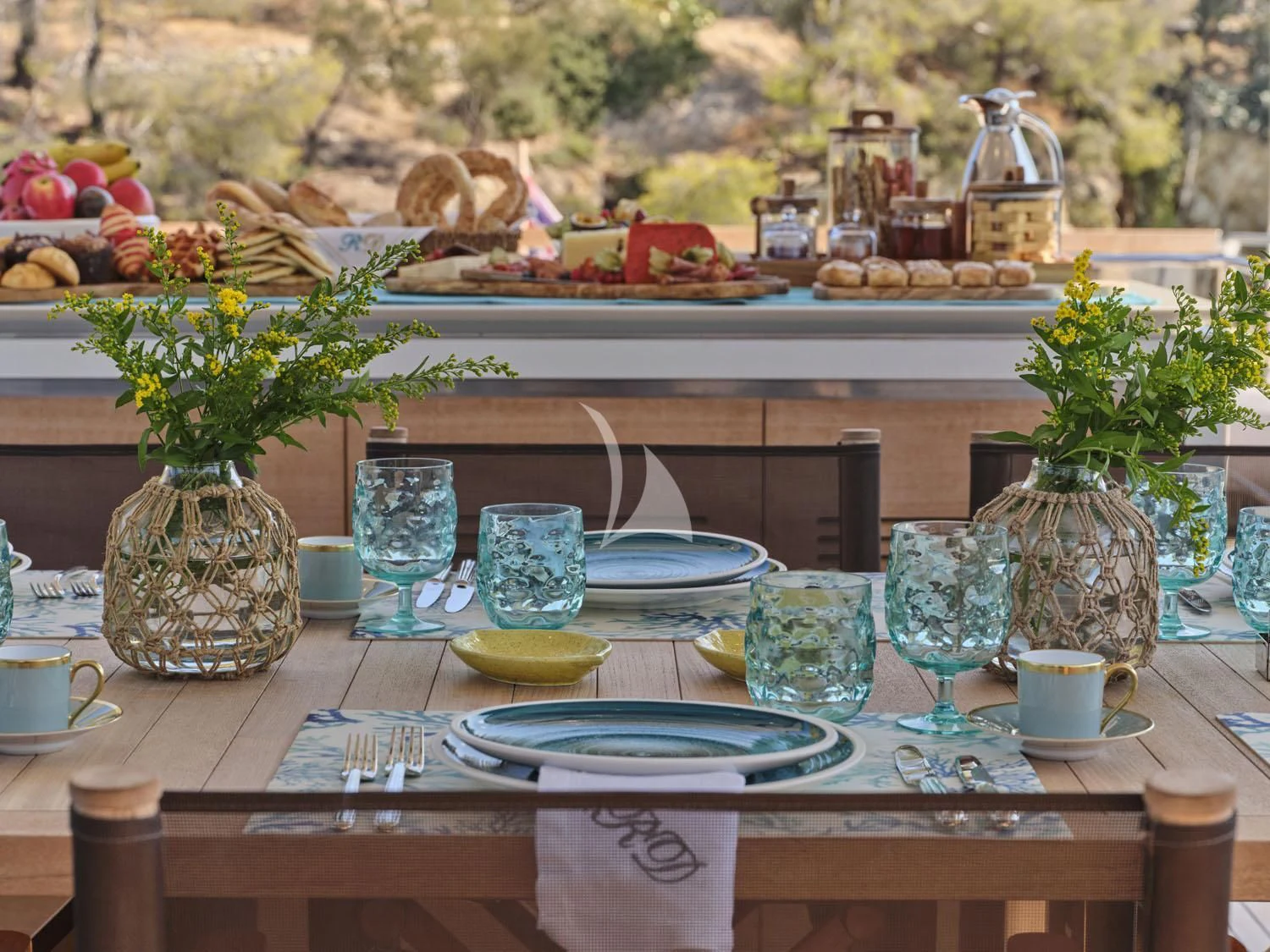 a table with many dishes on it aboard RARE DIAMOND Yacht for Sale