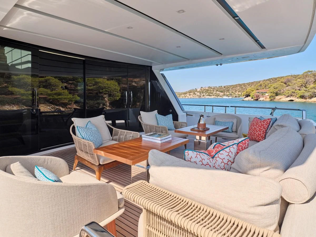 a room with a view of the ocean and the mountains aboard RARE DIAMOND Yacht for Sale