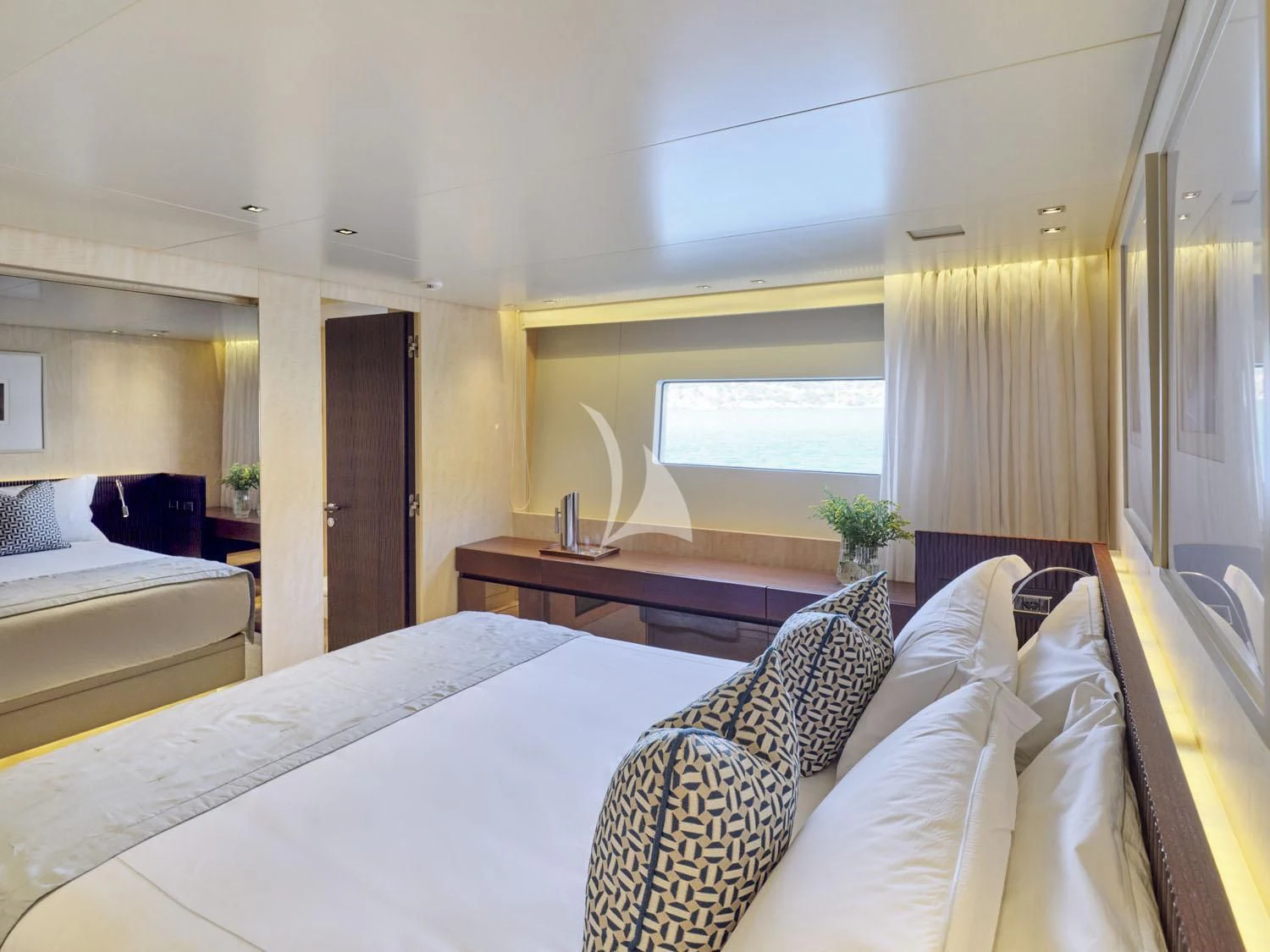 a room with a bed and a desk aboard RARE DIAMOND Yacht for Sale