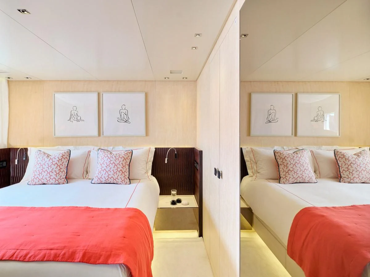 a room with a couple of beds aboard RARE DIAMOND Yacht for Sale