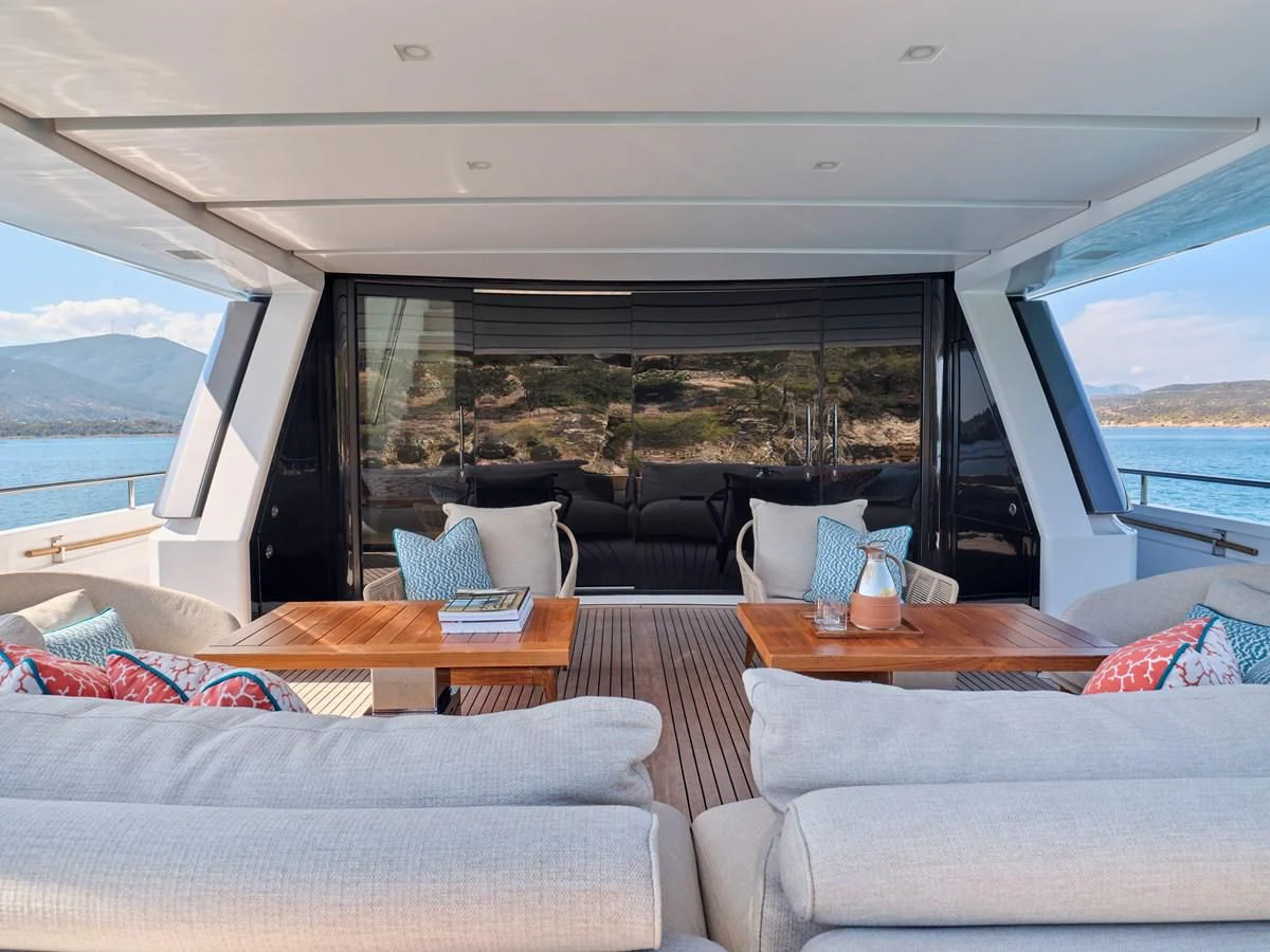 a living room with a large window aboard RARE DIAMOND Yacht for Sale