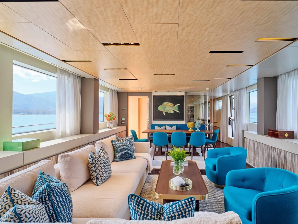 a living room with a couch and a table aboard RARE DIAMOND Yacht for Sale
