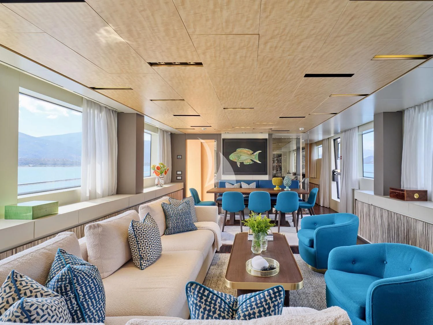 a living room with a couch and a table aboard RARE DIAMOND Yacht for Sale