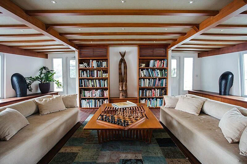 a living room with a couch and a coffee table aboard DOT Yacht for Sale