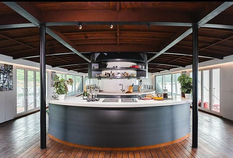 a kitchen with a large island aboard DOT Yacht for Sale