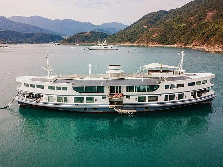 a large white boat in the water aboard DOT Yacht for Sale