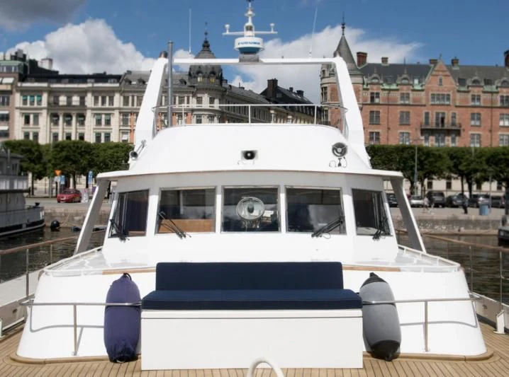 a white boat with a white roof aboard STELLA NOVA Yacht for Sale