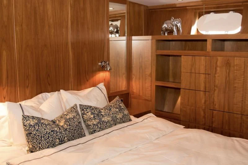 a bed with pillows aboard STELLA NOVA Yacht for Sale