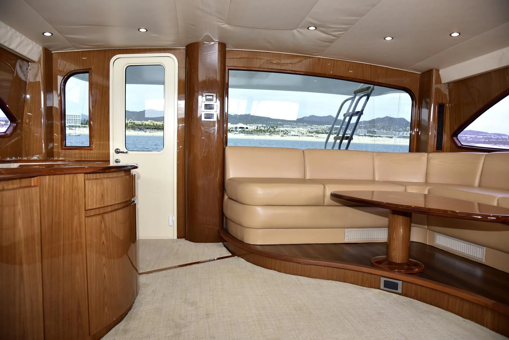 a room with a couch and a table aboard SALTY K Yacht for Sale