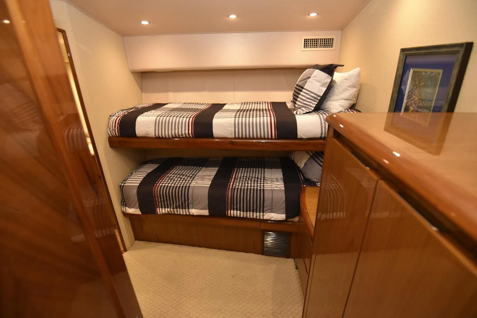 a bed with a wooden frame aboard SALTY K Yacht for Sale