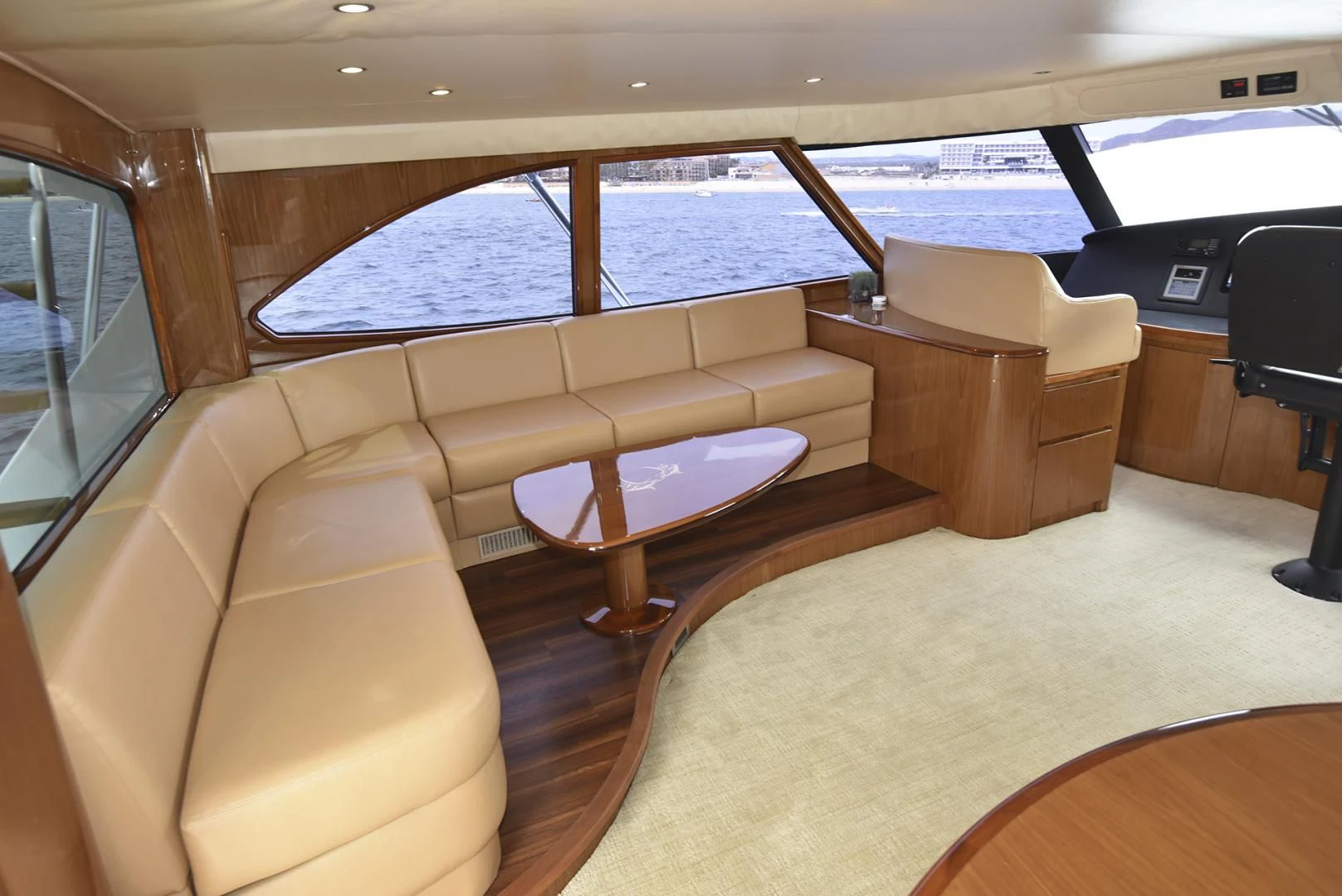 a room with a couch and a table and a window aboard SALTY K Yacht for Sale