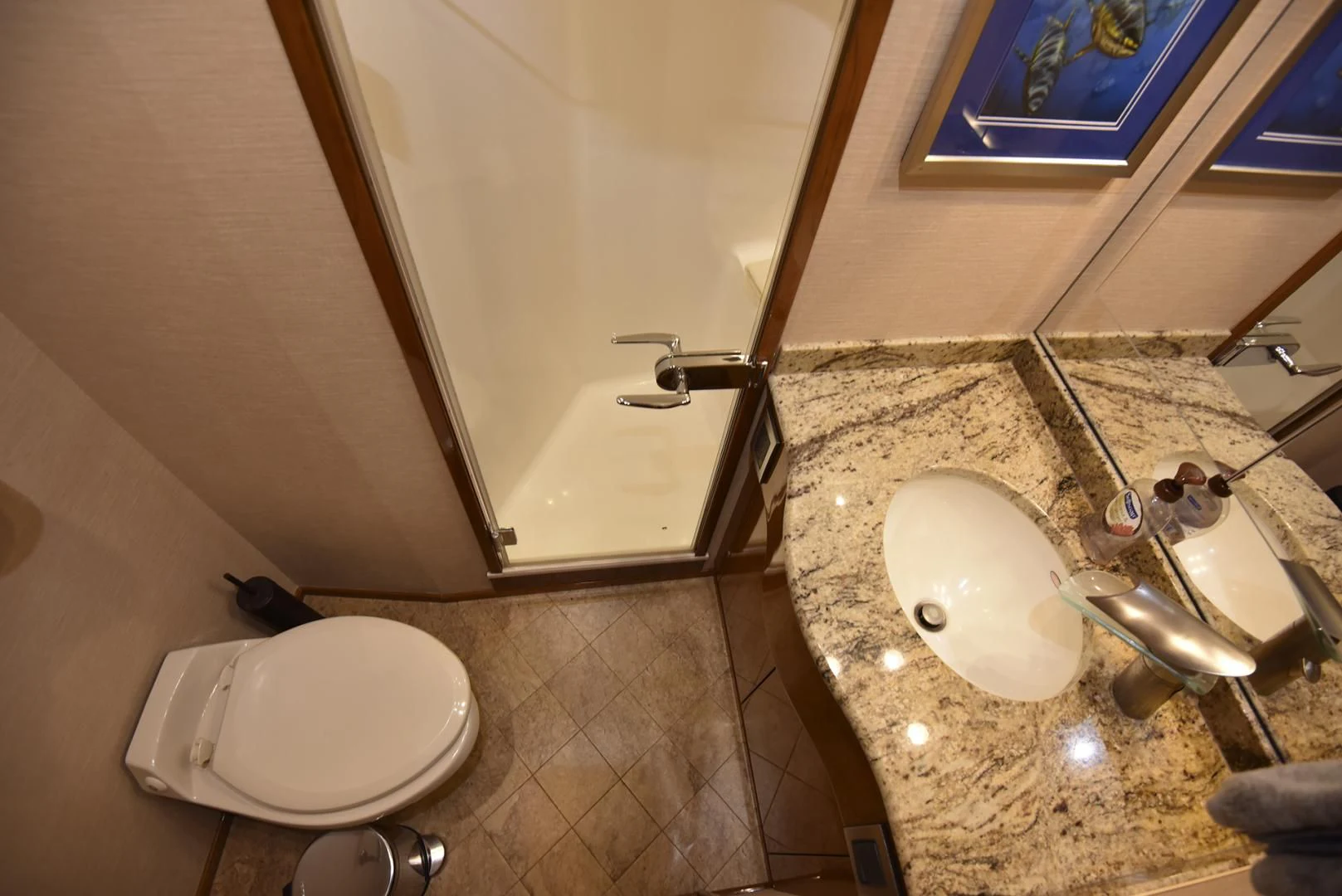 a bathroom with a sink and a mirror aboard SALTY K Yacht for Sale