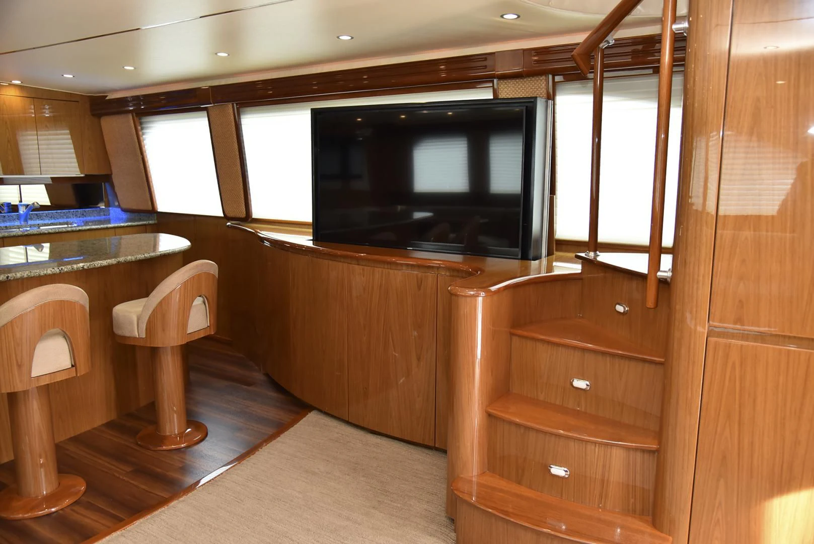 a room with a tv and a table aboard SALTY K Yacht for Sale
