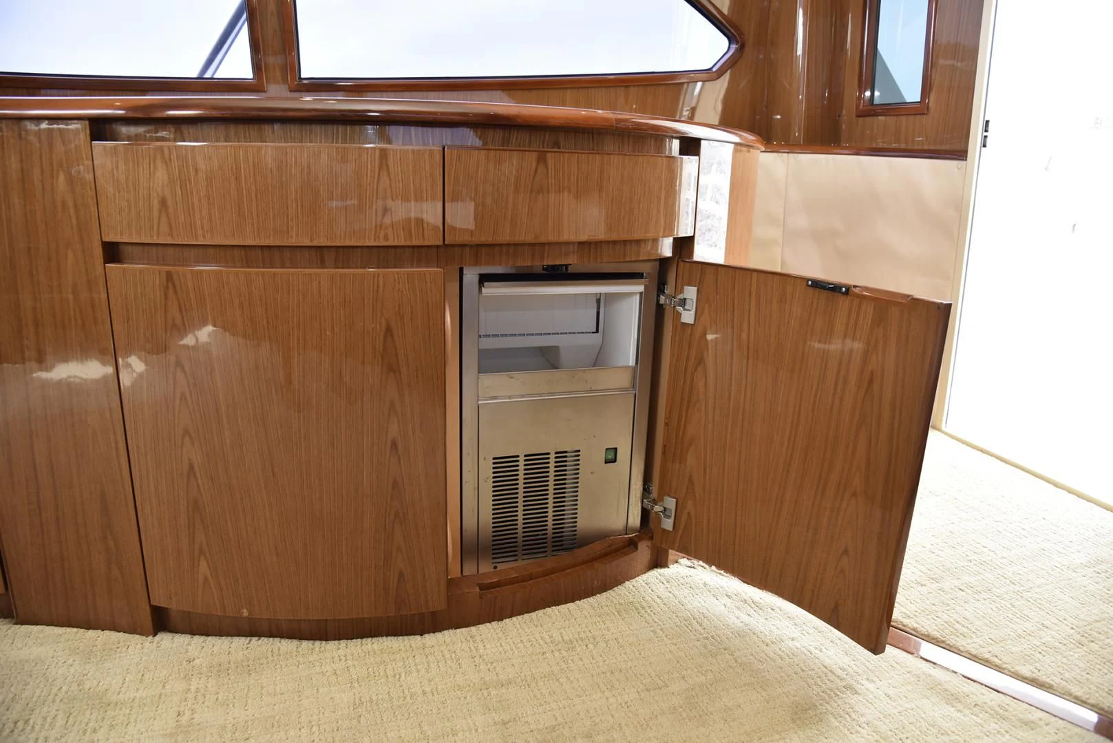 a wooden cabinet with a vent aboard SALTY K Yacht for Sale