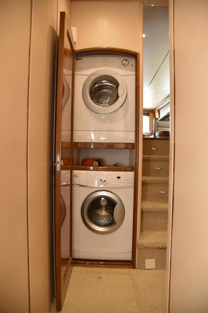 a washer and dryer in a room aboard SALTY K Yacht for Sale