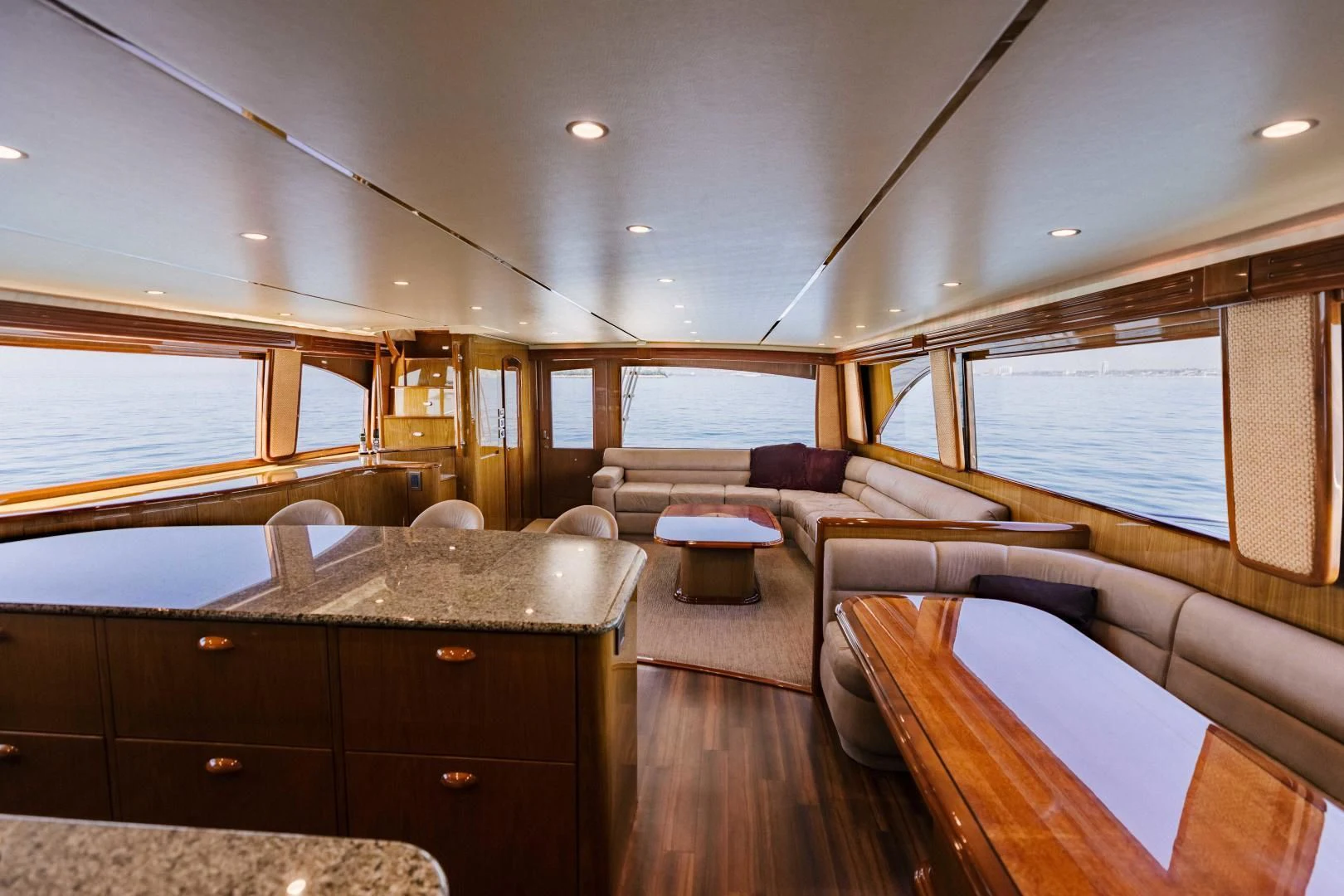 a living room with a large window aboard SALTY K Yacht for Sale