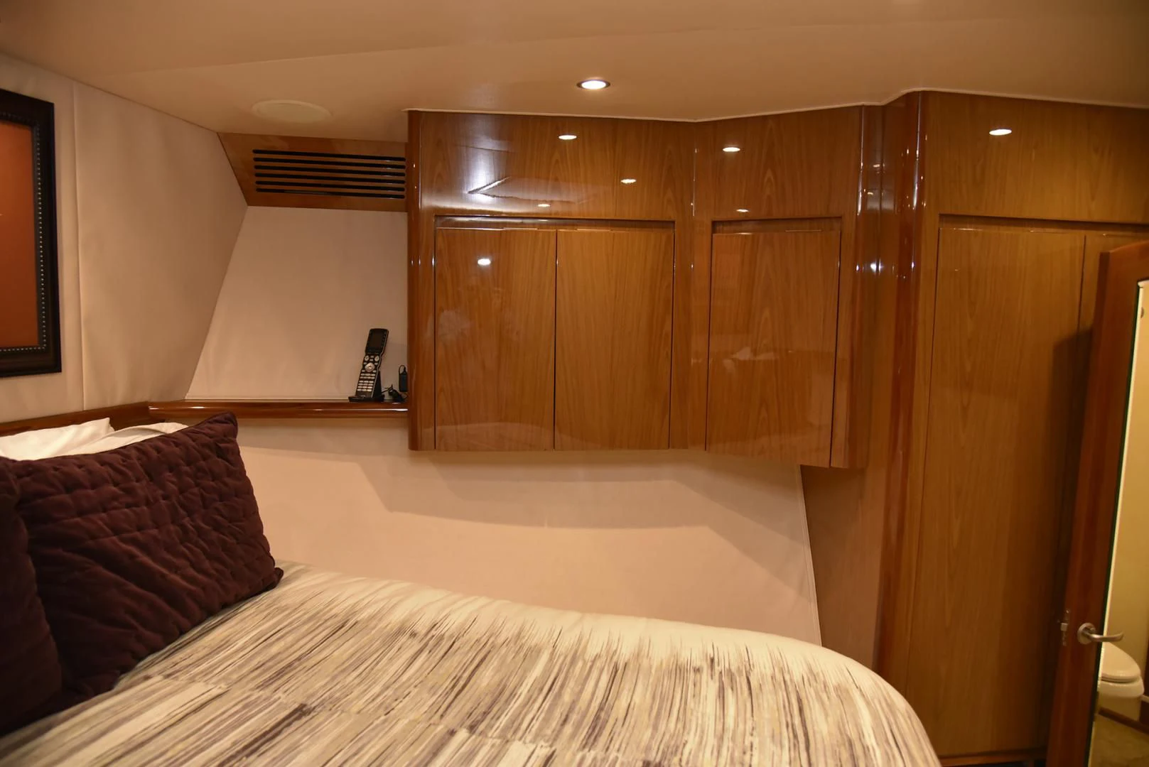a bed with a white sheet aboard SALTY K Yacht for Sale