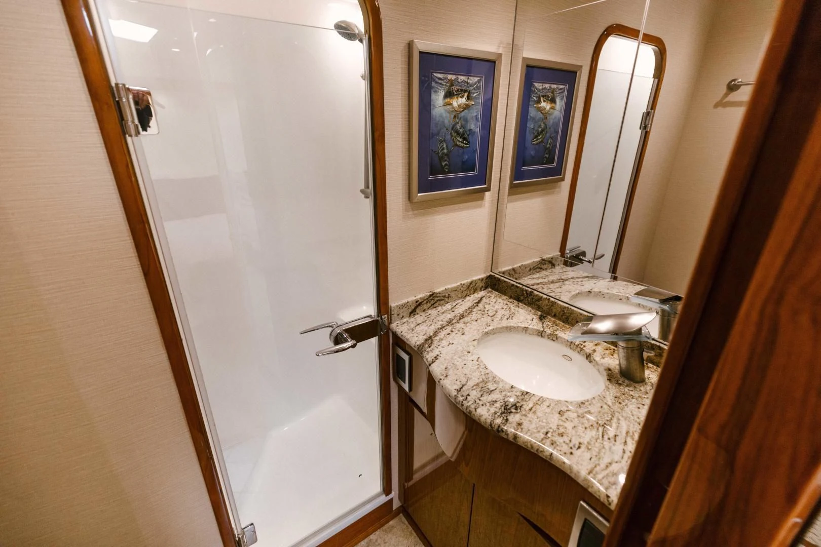 a bathroom with a sink and a mirror aboard SALTY K Yacht for Sale