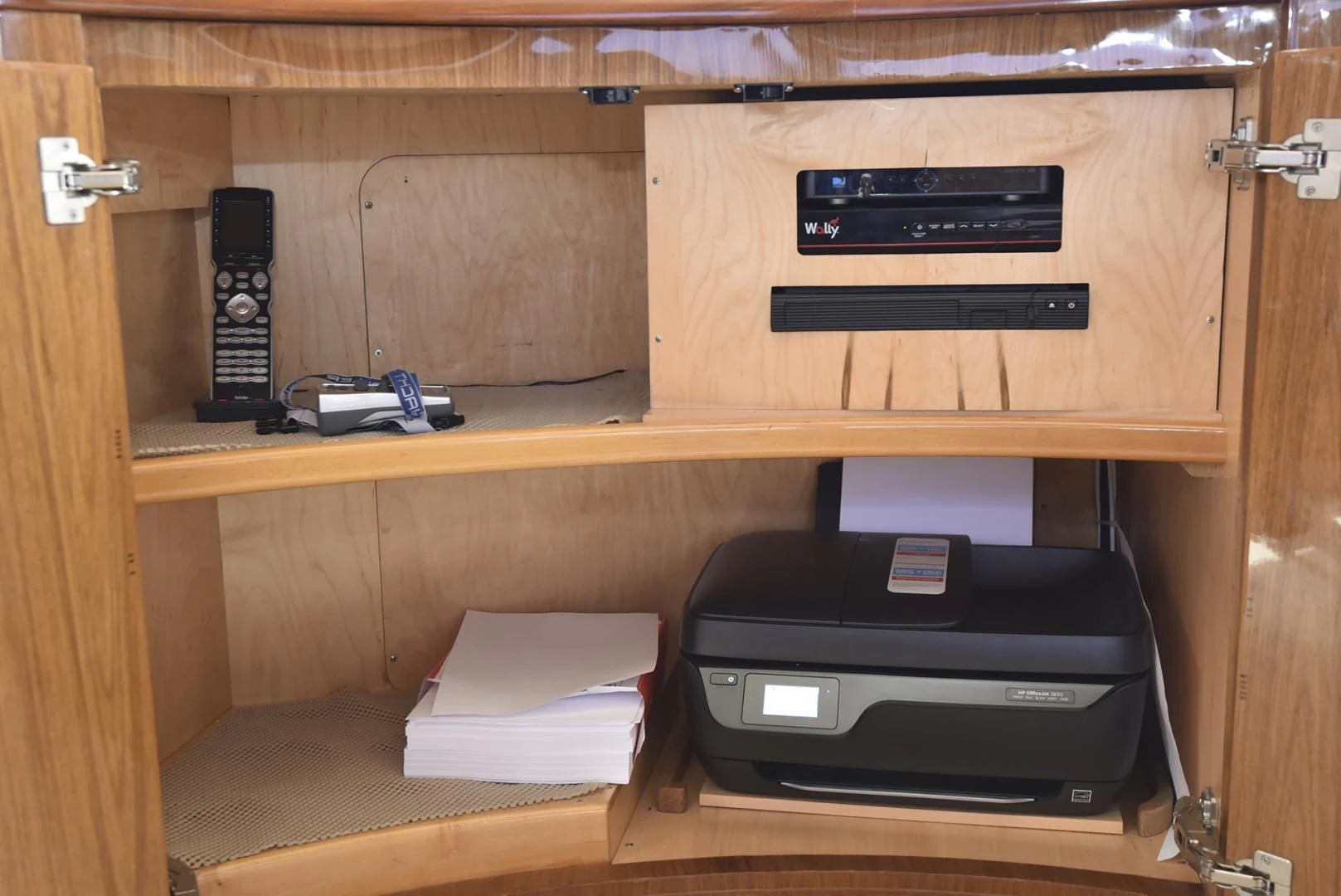 a black printer on a wooden shelf aboard SALTY K Yacht for Sale