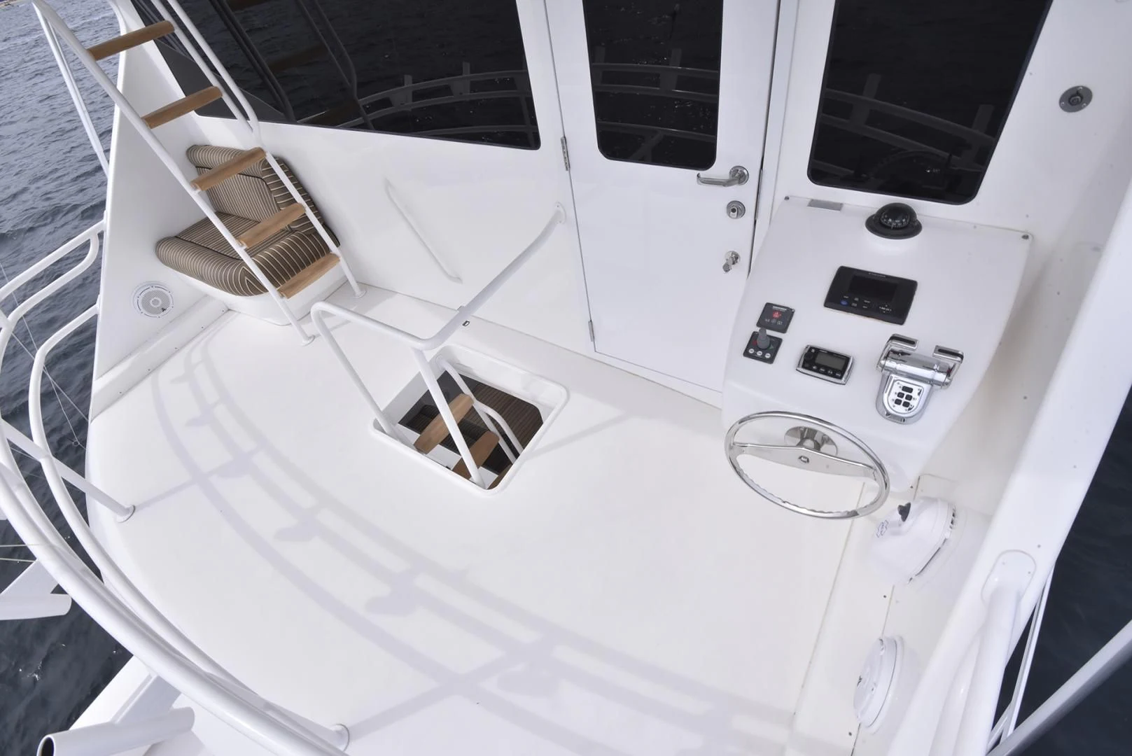 a white car with a white hood aboard SALTY K Yacht for Sale