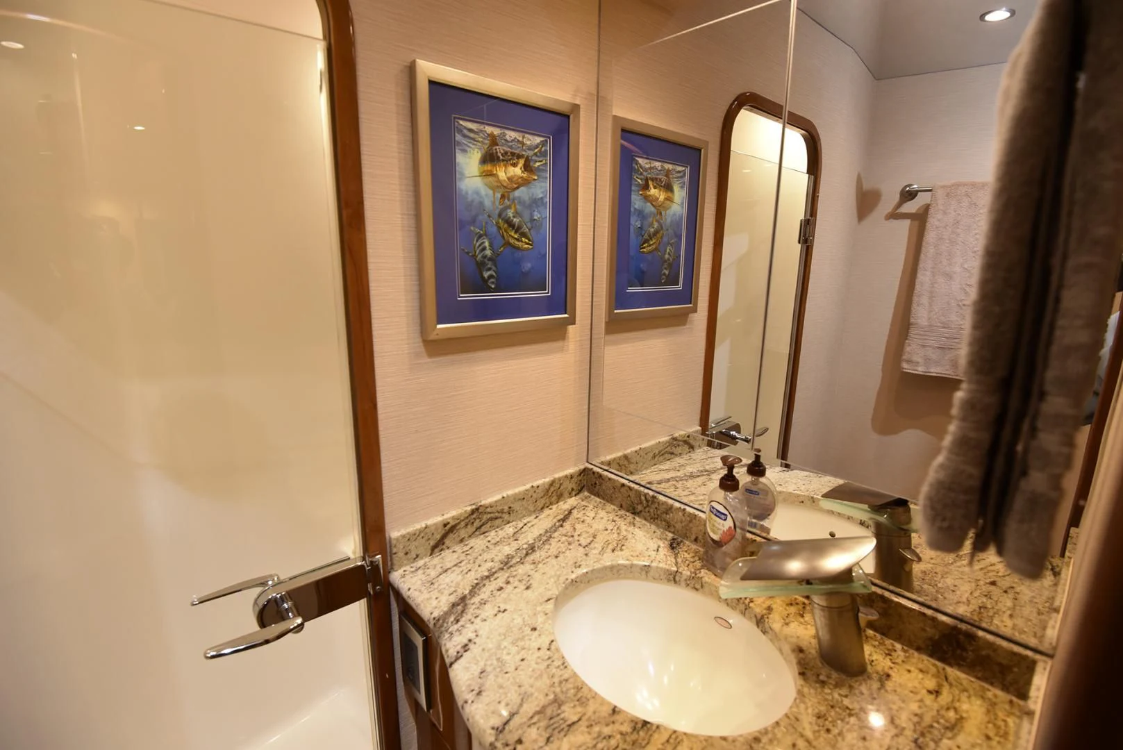 a bathroom with a sink and a mirror aboard SALTY K Yacht for Sale